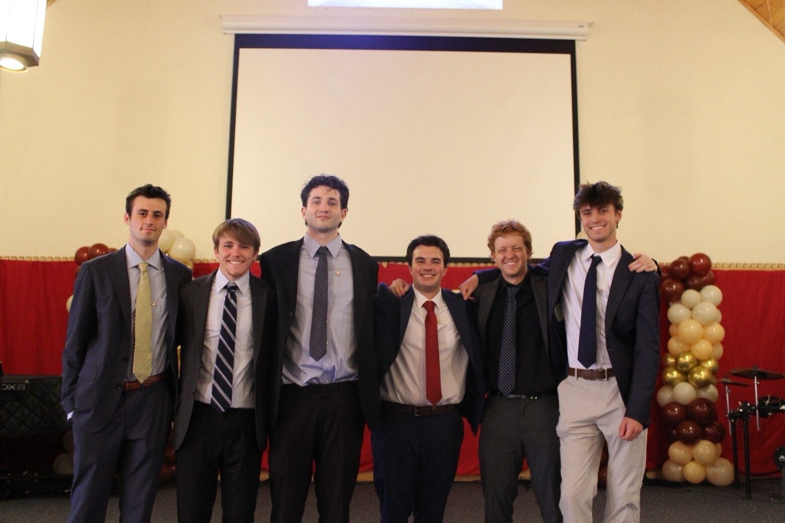 Brothers in suits at a formal event
