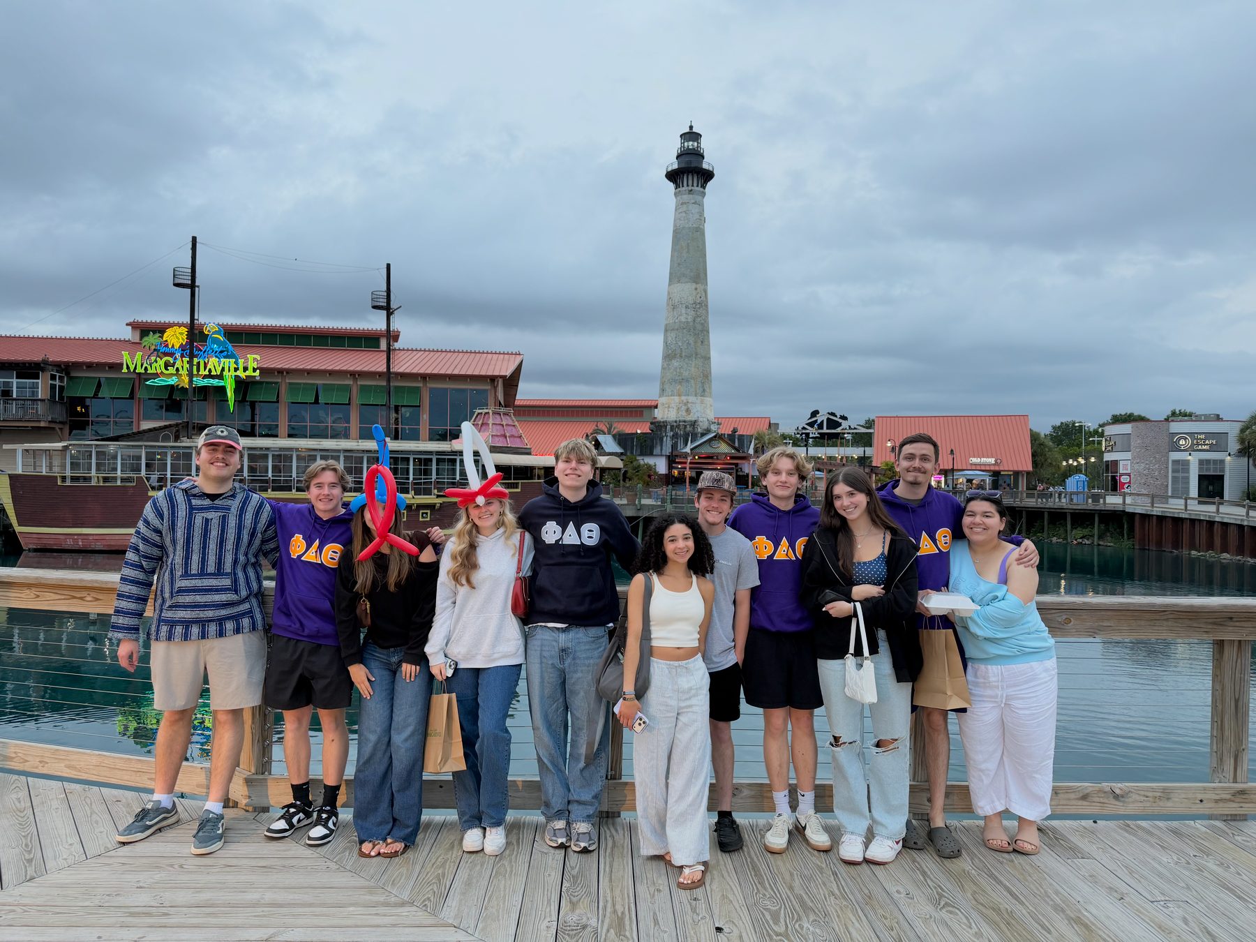 Brothers and friends on a boardwalk